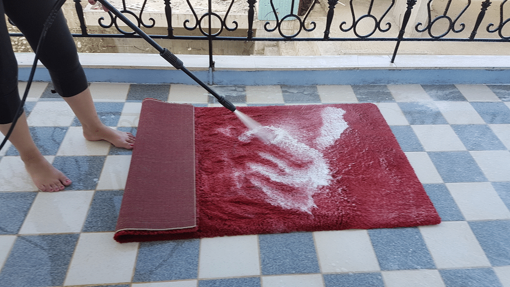 Using a power washer can make cleaning rugs an easy chore to do